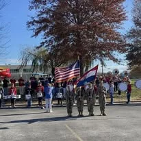 Color guard presenting flags before the race