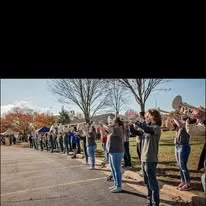 Participants saluting during the ceremony