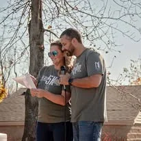 A couple speaking at the outdoor podium