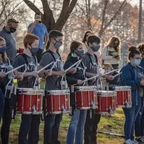 Drumline members performing at the event